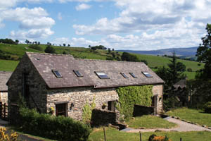 Stone holiday cottages at Penrhyddion Pella near Capel Garmon